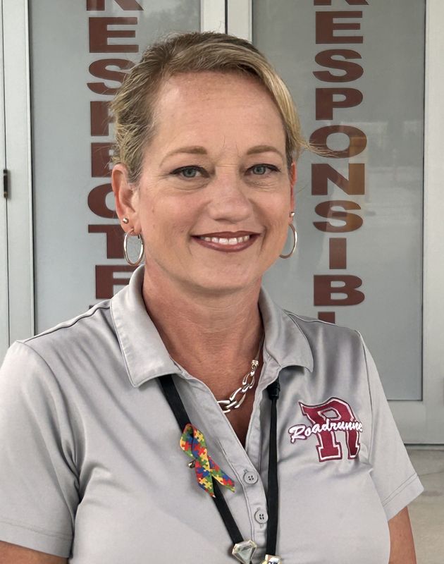 Rymfire Elementary School Assistant Principal Abra Seay ran off a gator that had camped out beneath a teacher's car at the campus in Palm Coast Aug. 4, 2026.