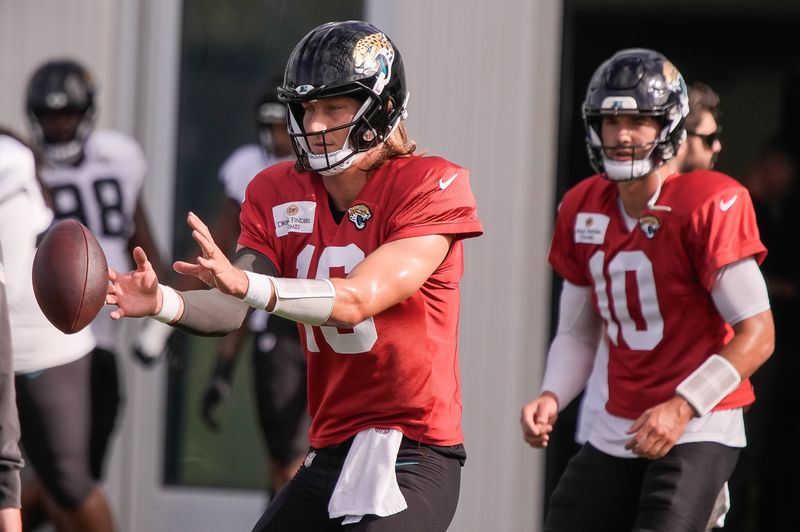 Jacksonville Jaguars Quarterback Trevor Lawrence (16) takes a snap during the Jacksonville Jaguars eighth day of NFL Training Camp at the Miller Electric Center in Jacksonville, Fla., Friday, August 7, 2026.    [Doug Engle/Florida Times-Union]