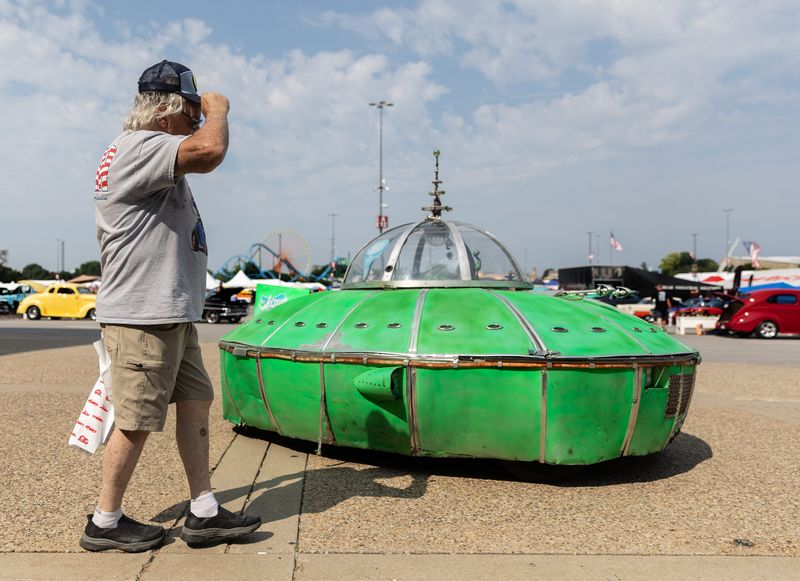 Larry Young adjusts his hat after seeing the Jetson’s flying car on display at the 57th annual Street Rod Nationals, in Louisville, Kentucky. Young traveled from Toronto, Canada with his 1955 Chevy to attend the show at the Kentucky Expo Center. Aug. 7, 2026