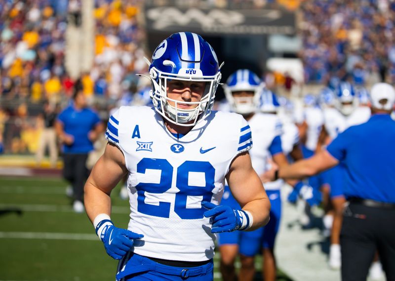 Nov 23, 2024; Tempe, Arizona, USA; Brigham Young Cougars safety Tanner Wall (28) against the Arizona State Sun Devils at Mountain America Stadium. Mandatory Credit: Mark J. Rebilas-Imagn Images