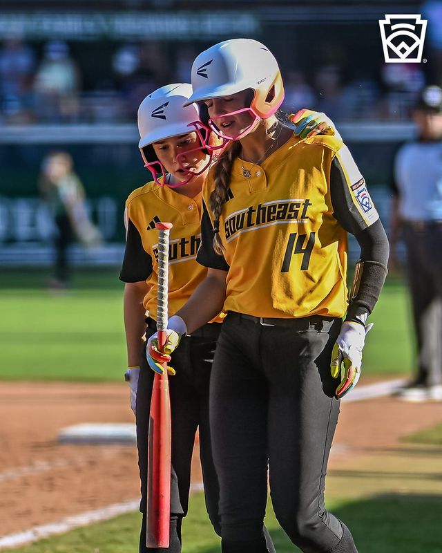 Lake Mary softball player Brynn Fieser gets advice from a teammate during Florida's game vs. Snohomish, Washington at the 2026 Little League Softball World Series on Aug. 7, 2026, in Greenville, North Carolina.