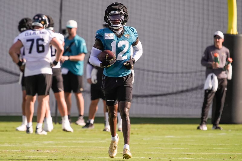 Jacksonville Jaguars Cornerback/Wide Receiver Travis Hunter (12) jogs back after catching a pass during the Jacksonville Jaguars 10th day of NFL Training Camp at the Miller Electric Center in Jacksonville, Fla., Sunday, August 9, 2026.    [Doug Engle/Florida Times-Union]