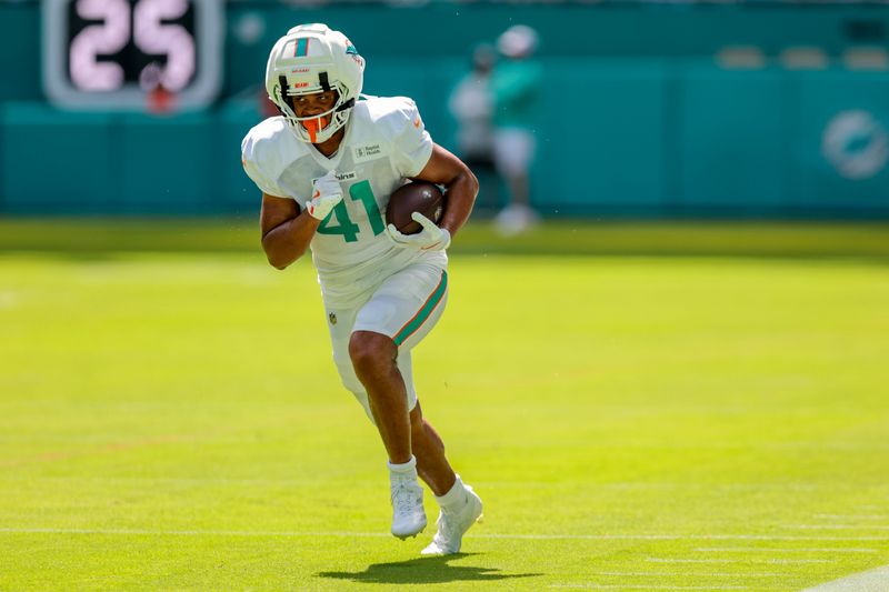 Aug 8, 2026; Miami Gardens, FL, USA; Miami Dolphins tight end Louis Moore (41) works during practice at Hard Rock Stadium. Mandatory Credit: Sam Navarro-Imagn Images