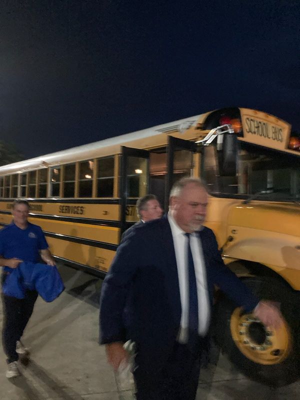 Duval County schools Superintendent Christopher Bernier (right) and Brad Kerrigan, Durham School Services regional manager, walk Durham's school bus depot on Phillips Industrial Boulevard while buses leave August 10 for the first day of school.