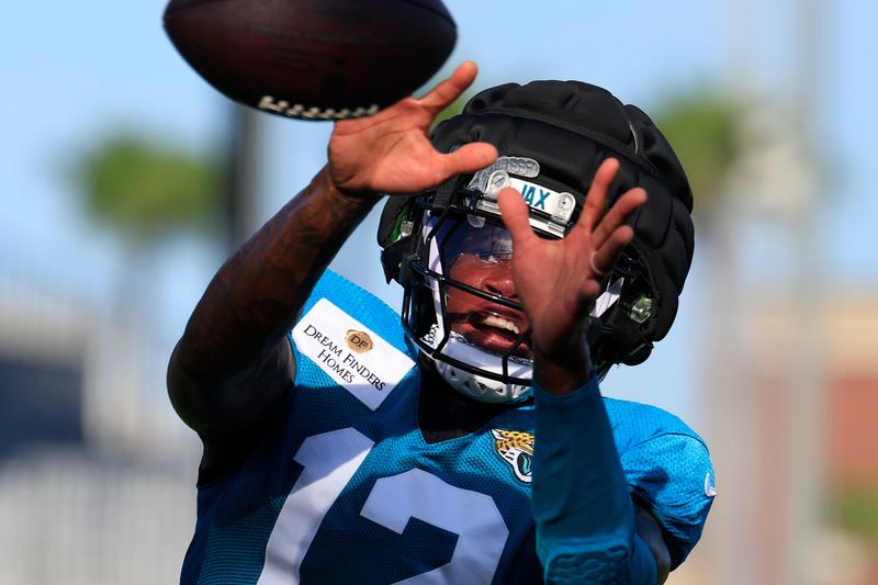 Jacksonville Jaguars wide receiver/cornerback Travis Hunter (12) catches a pass during Day 11 of NFL training camp at the Miller Electric Center on Tuesday, Aug. 11, 2026, in Jacksonville, Fla.