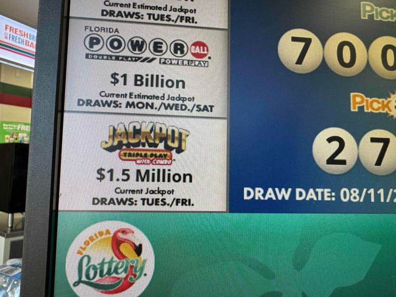 Signs show Powerball jackpot for $1 billion for Wednesday, Aug. 12, 2026, lottery drawing. A ticket in Quincy, Illinois, won $1.04 billion grand prize with several $1 million winners, including in Florida.