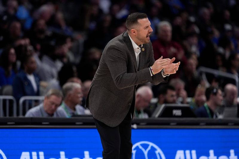 Mar 12, 2026; Charlotte, NC, USA; Florida State Seminoles head coach Luke Loucks encourages his team  during the second half against the Duke Blue Devils at Spectrum Center. Mandatory Credit: Jim Dedmon-Imagn Images