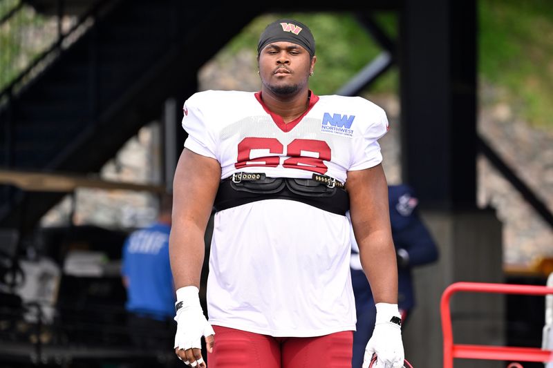 Aug 6, 2025; Foxborough, MA, USA; Washington Commanders guard Timothy McKay (68) arrives at training camp at Gillette Stadium. Mandatory Credit: Eric Canha-Imagn Images
