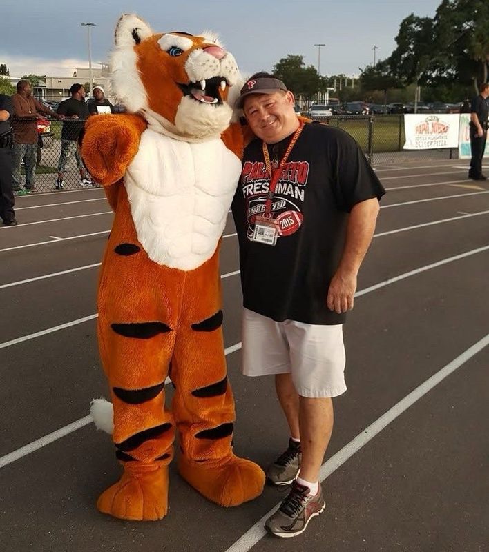 Bryan Wilkes with the Palmetto High Tiger mascot.
