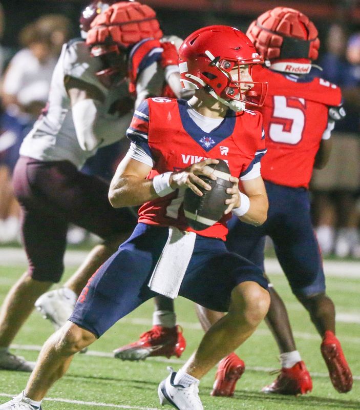 Fort Walton Beach quarterback Lavin McDaniel scans the field for an open receiver during Thursday night's Kickoff Classic versus Niceville.