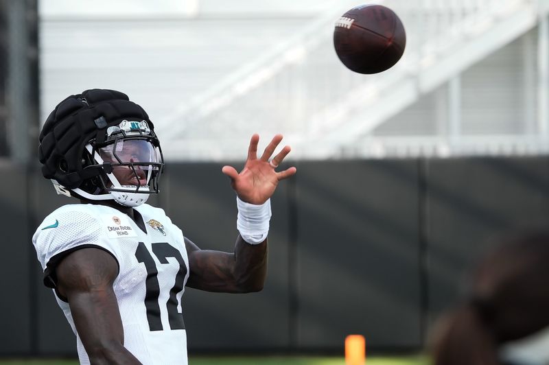 Jacksonville Jaguars Cornerback/Wide Receiver Travis Hunter (12) catches a pass one handed during the Jacksonville Jaguars 14th session of NFL Training Camp at the Miller Electric Center in Jacksonville, Fla., Monday, August 17, 2026.    [Doug Engle/Florida Times-Union]