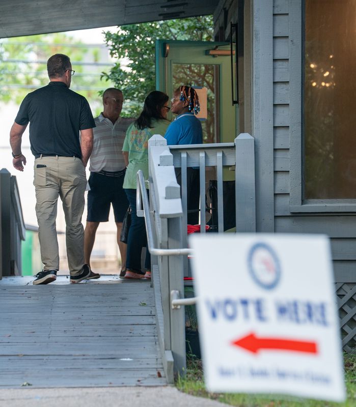 People enter to vote as the polls open at Asbury Place on Primary Election Day in Pensacola on Aug. 18, 2026.