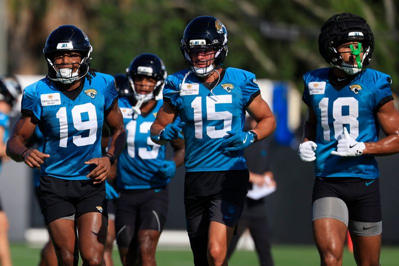 Jacksonville Jaguars wide receiver Josh Cameron (19), wide receiver Chandler Brayboy (15) and wide receiver CJ Williams (18) run on the field during Day 15 of NFL training camp at the Miller Electric Center on Tuesday, Aug. 18, 2026, in Jacksonville, Fla.