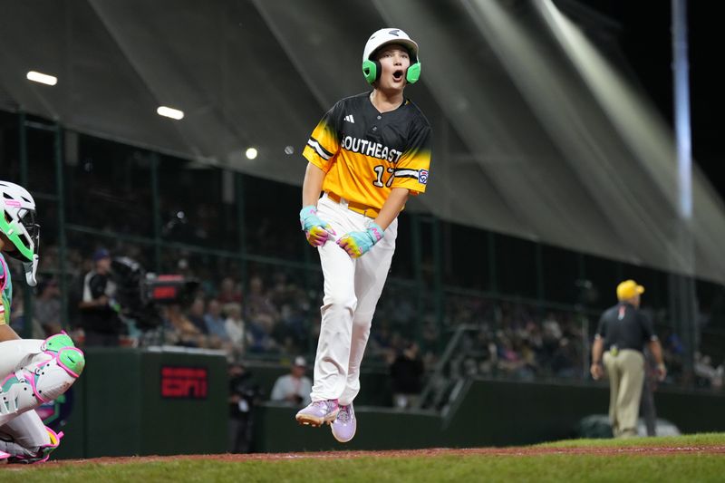 Aug 21, 2025; Williamsport, PA, USA; Brody Miller (17) of Southeast Region reacts after scoring a run against Mountain Region in the fifth inning at Howard J. Lamade Stadium. Mandatory Credit: Kyle Ross-Imagn Images