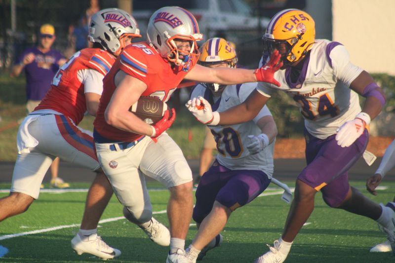 Bolles running back Xander Edwards (25) attempts to stiff-arm Columbia defensive end Mikel Morgan (34) during a high school football game on Aug. 21, 2026 in Jacksonville, Florida. [Clayton Freeman/Florida Times-Union]