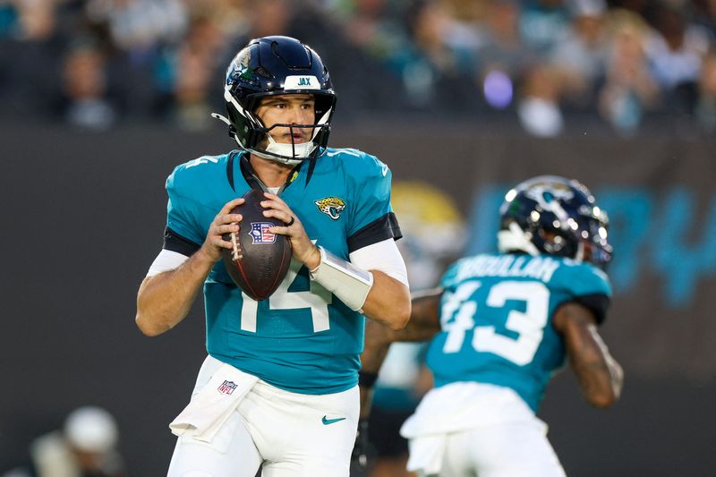 Aug 21, 2026; Jacksonville, Florida, USA; Jacksonville Jaguars quarterback Nick Mullens (14) drops back to pass against the Carolina Panthers in the first quarter during a preseason game at EverBank Stadium. Mandatory Credit: Nathan Ray Seebeck-Imagn Images