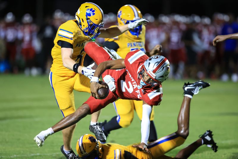 Santa Fe Raiders player Gavin Peterson (2) runs with the ball during the first half of a football game between Newberry High School and Santa Fe High School at Newberry High School in Gainesville, FL on Friday, August 21, 2026. [Chris Watkins/Gainesville Sun]