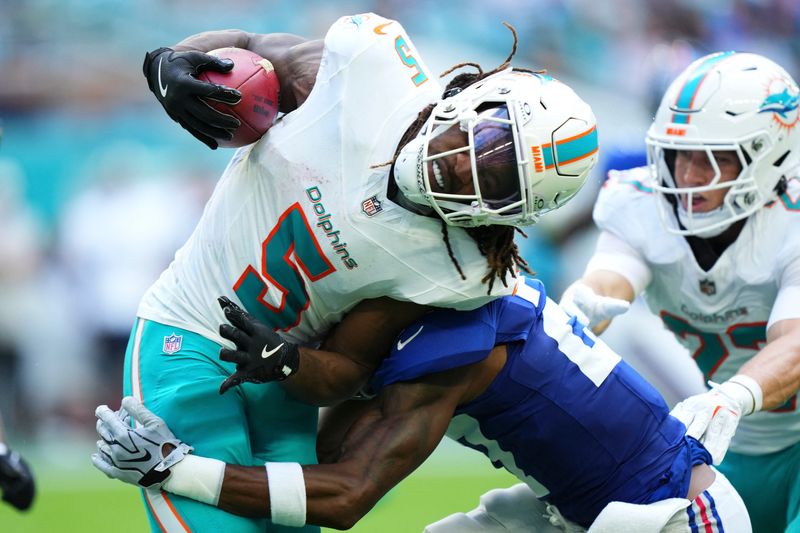 Aug 22, 2026; Miami Gardens, Florida, USA;  New York Giants defensive back Tyler Nubin (27) tackle Miami Dolphins running back Jaylen Wright (5) during the first quarter of a preseason game at Hard Rock Stadium.  Mandatory Credit: Rich Storry-Imagn Images