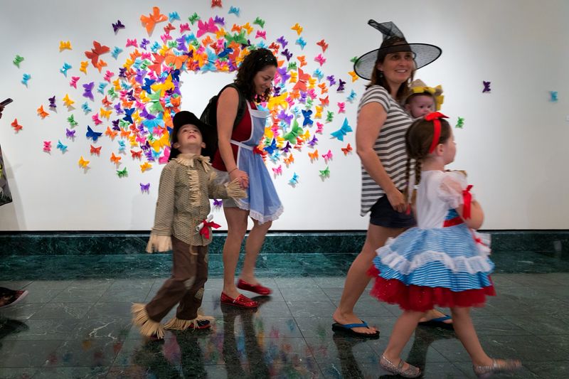 A family walks through the Baker Museum in Naples.