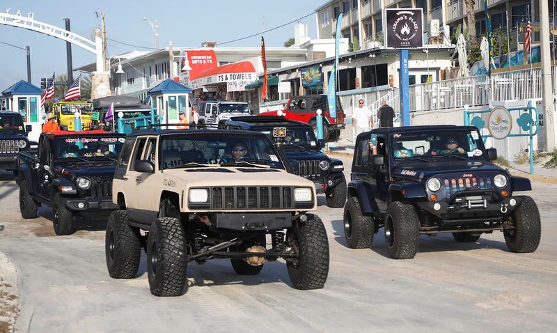 Jeeps begin to enter the International Speedway Boulevard approach for the "Jeep Beach Sweep on Sunday, May 1, 2022. On the last day of Jeep Beach, drivers and their vehicles parade down the beach, picking up garbage as they go.