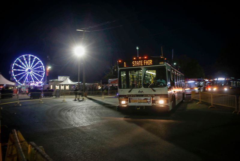 State Fair shuttles depart from Gate 10 at the Iowa State Fair and head for a downtown parking garage on Saturday, August 12, 2017, in Des Moines.