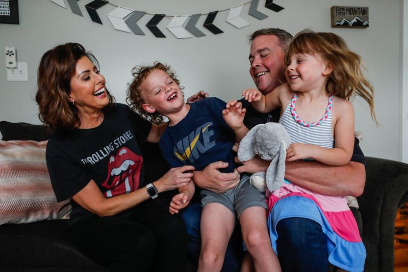 Erin Kiernan, left, Michael Francis Kiernan, 7, Michael Kiernan, and Audrey Kiernan, 5, pose for a photo in the playroom of their Des Moines home on Friday, June 9, 2023.