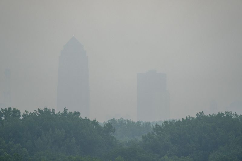 A smoky haze surrounds downtown Des Moines on Wednesday, June 28, 2023. The smoke from Canadian Canadian wildfires has drifted into the upper Midwest US prompting air quality warnings.