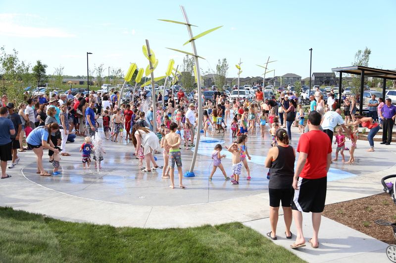 Children play at the splash pad at Fox Creek Park in Waukee.