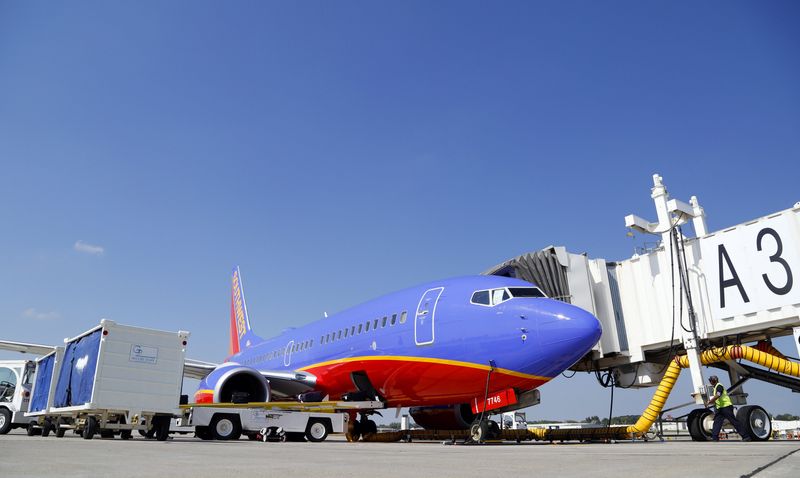A Southwest Airlines plane is serviced at the gate on Sept. 25, 2013, at the Des Moines International Airport.