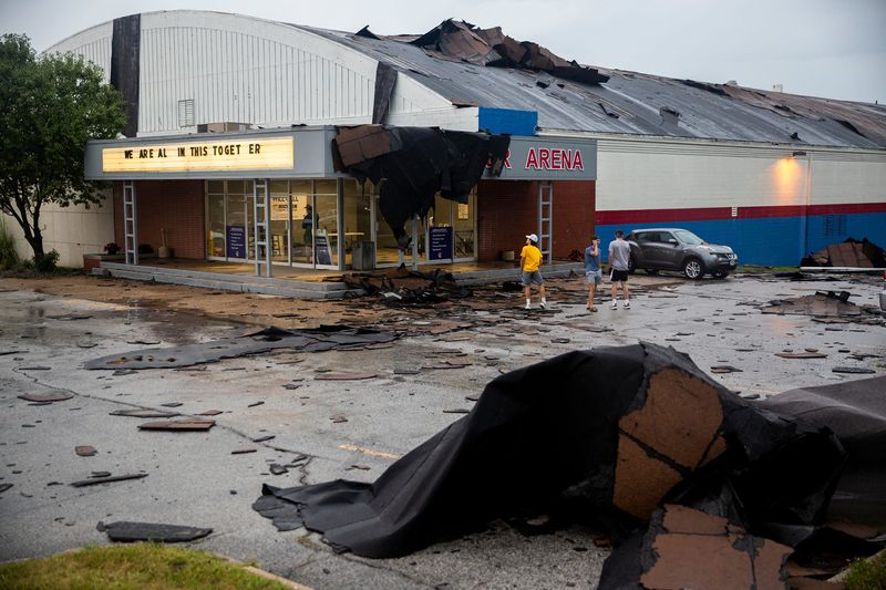 Pieces of the Buccaneer Arena roof litter the parking lot after a strong thunderstorm with high winds blew through the Des Moines metro on Monday, Aug. 10. 2020, in Urbandale.