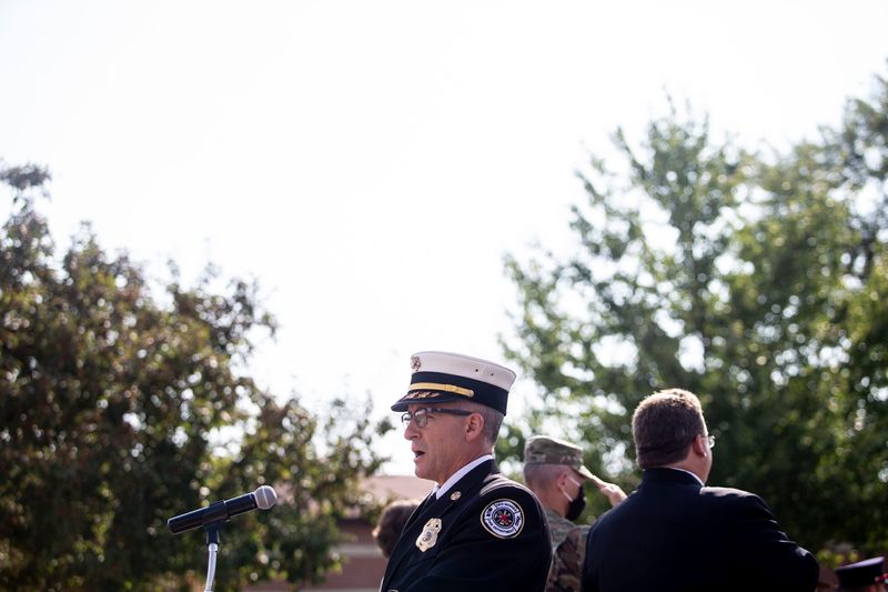 Des Moines Fire Chief John Tekippe signs the national anthem before the grand opening of the Iowa Fire Service Training Bureau's new headquarters at Camp Dodge, on Wednesday, Aug. 12, 2020, in Johnston.