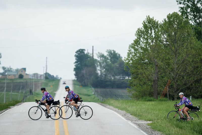 Cyclists make their way from Ankeny to the High Trestle Trail Bridge during the annual Pigtails ride along the High Trestle trail on Saturday, May 22, 2021, in Madrid, IA.
