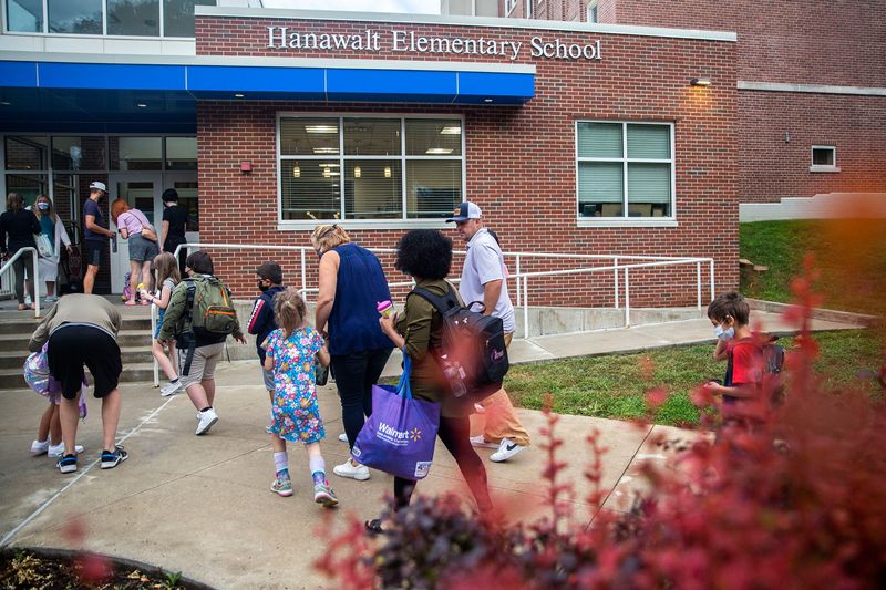 Students arrive at Hanawalt Elementary for the first day back to school, on Wednesday, Aug. 25, 2021, in Des Moines.