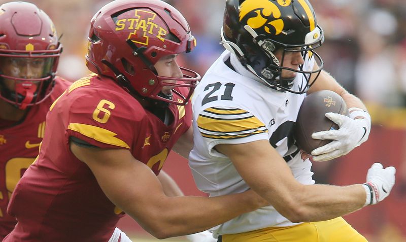 Iowa State Cyclones' special team Myles Mendeszoon (6) takes down Iowa Hawkeyes' punt returner Kaden Wetjen (21) during a punt return in the fourth quarter of the Cy-Hawk football game at the Jack Trice Stadium on Saturday, Sept. 9, 2023, in Ames, Iowa.