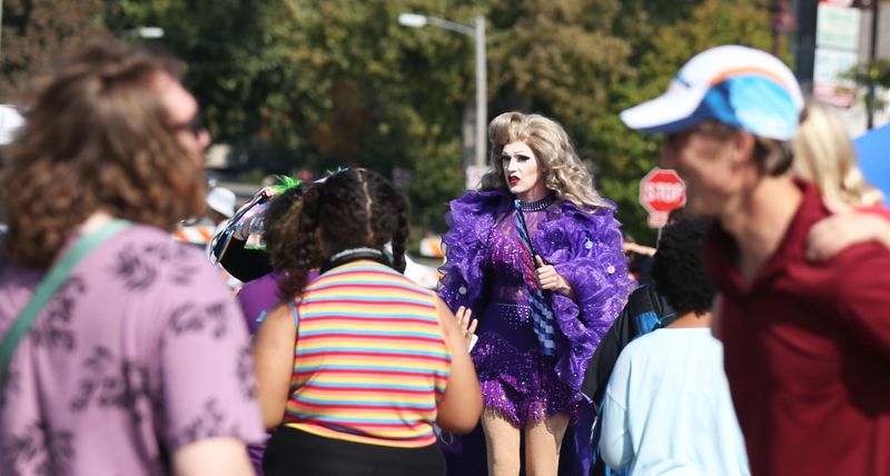A performer of a drag show looks around vendors at the Pride Fest in downtown Ames on Saturday, Sept. 30, 2023, in Ames, Iowa.