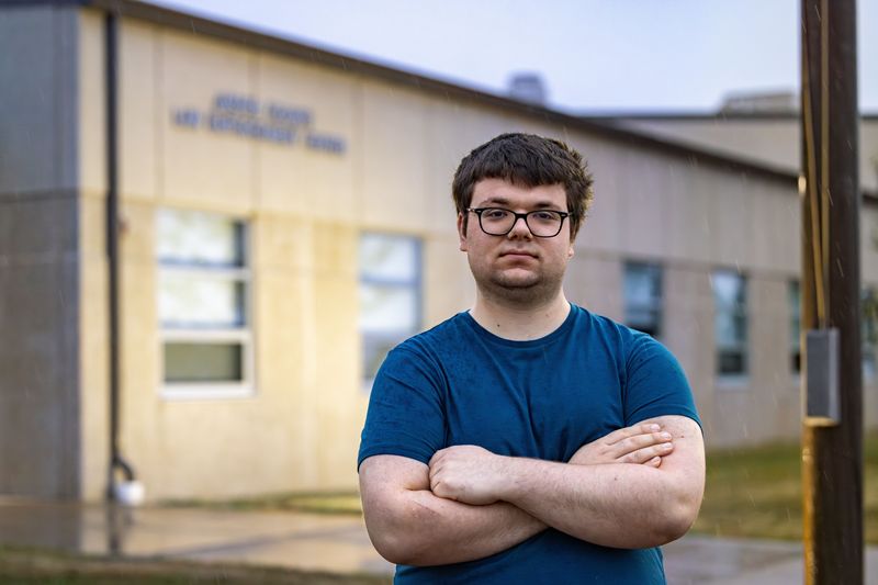 Newton resident Noah Petersen poses outside the Jasper County jail. Petersen is suing the City of Newton after he was twice arrested for violating a policy against "derogatory comments" during city council meetings.