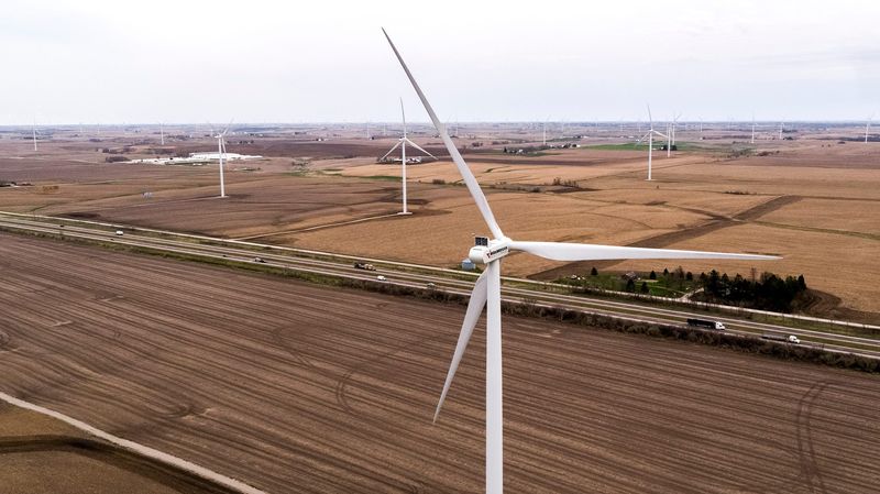 Wind turbines turn in the breeze along Interstate 80 on Wednesday, April 7, 2021, in Poweshiek County.
