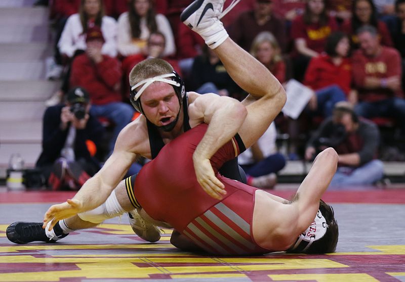 Iowa Hawkeyes Patrick Kennedy takes down Iowa State Cyclones MJ Gaitan their 174-pound wrestling at Hilton Coliseum on Sunday, Nov. 26, 2023, in Ames, Iowa.