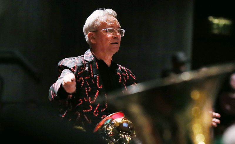Iowa State University band and Ames Municipal Band director Michael Golemo conducts at the Ames Tubachristmas musical event in Stephens Auditorium on Saturday, Dec.2. 2023, in Ames, Iowa.