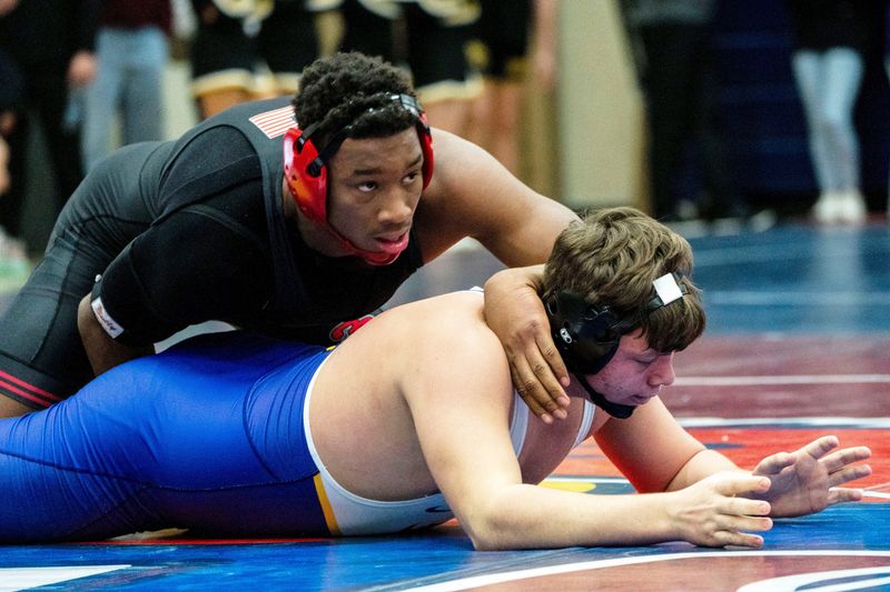 Fort Dodge's Dreshaun Ross wrestles Johnston's Mason Roethler during the 215-pound semifinal match of the Ed Winger Invite at Urbandale High School on Saturday, Jan. 20, 2024, in Urbandale.