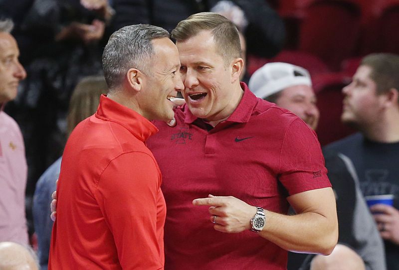 Iowa State Cyclones men's basketball head coach T. J. Otzelberger greets Texas Tech Red Raiders men's basketball head coach Grant McCasland before the game in the Big-12 conference showdown of a NCAA college basketball at Hilton Coliseum on Feb. 17, 2024, in Ames, Iowa.