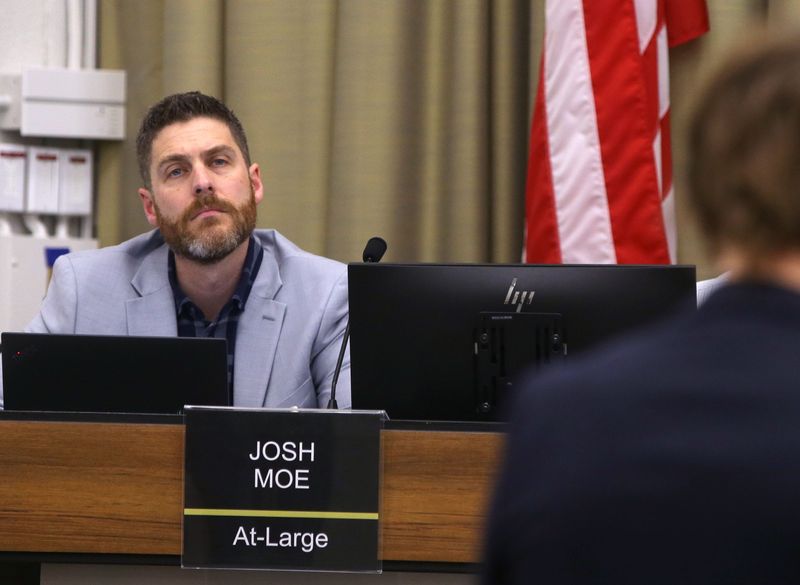 Iowa City’s Councilor At-Large Josh Moe, left, listens during a city council meeting Tuesday, Feb. 6, 2024 in Iowa City, Iowa.