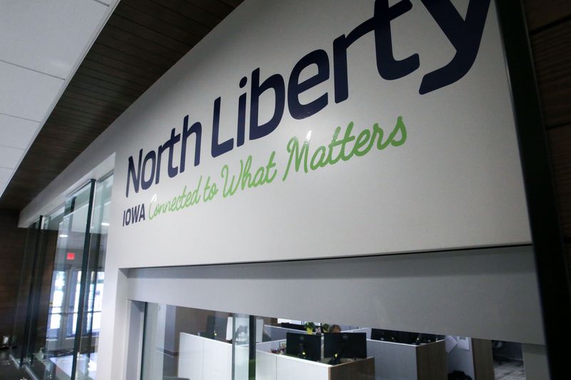A slogan for the town “North Liberty Iowa: Connected to what matters” is written above the customer service window in the new City Hall Wednesday, May 8, 2024 in North Liberty, Iowa.