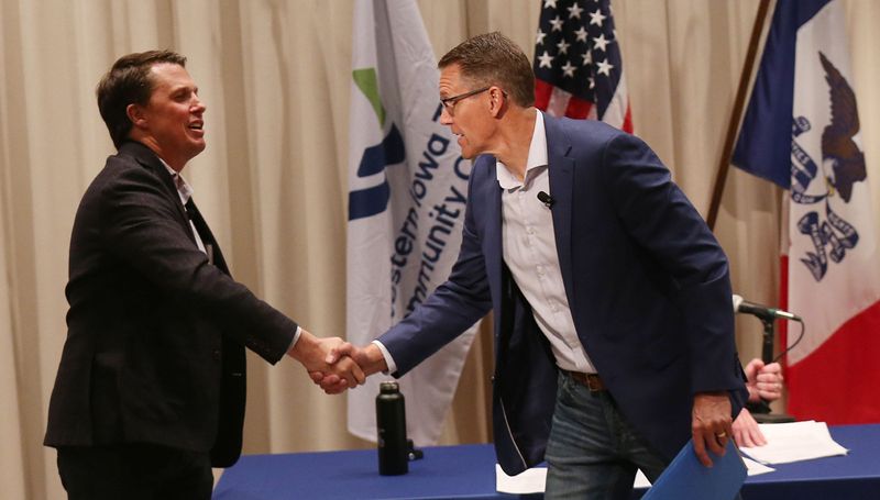 Iowa 4th District GOP candidates Rep. Randy Feenstra, right, and challenger Kevin Virgil shake hands after a candidate forum at Western Iowa Tech Community College on Thursday, May 30, 2024, in Cherokee, Iowa.