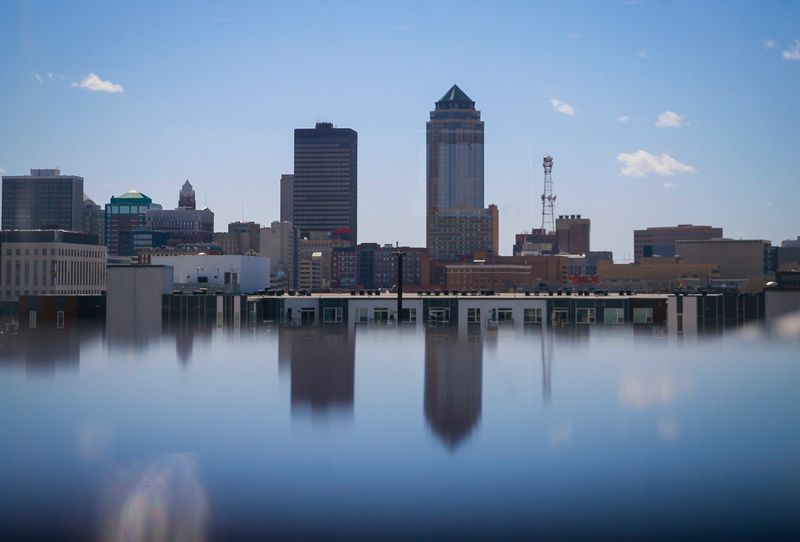 The downtown Des Moines skyline is reflected on the surface of a table at the Pura Social Club in Des Moines' East Village. The bar closed after a 2024 shooting for which a man has received a 25-year sentence.