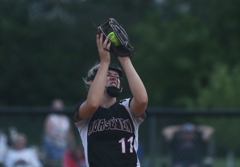 Roland-Story's second baseman Keely Oberender (11) catches the ball for an out during the fifth inning at Bill Hennessy field on Thursday, June 27, 2024, Roland, Iowa.