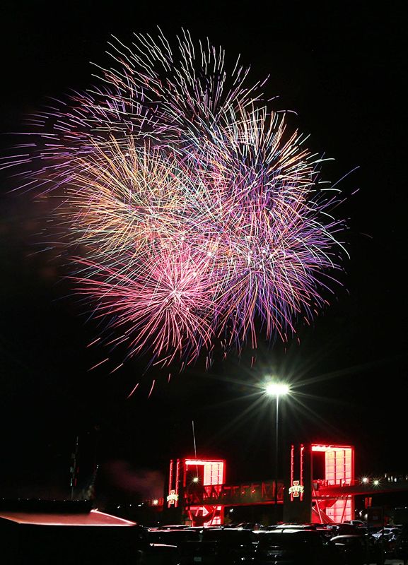 A fireworks display explodes in the sky of Ames, Iowa, as the Fourth of July celebration starts at Jack Trice Stadium on Wednesday, July 3, 2024.