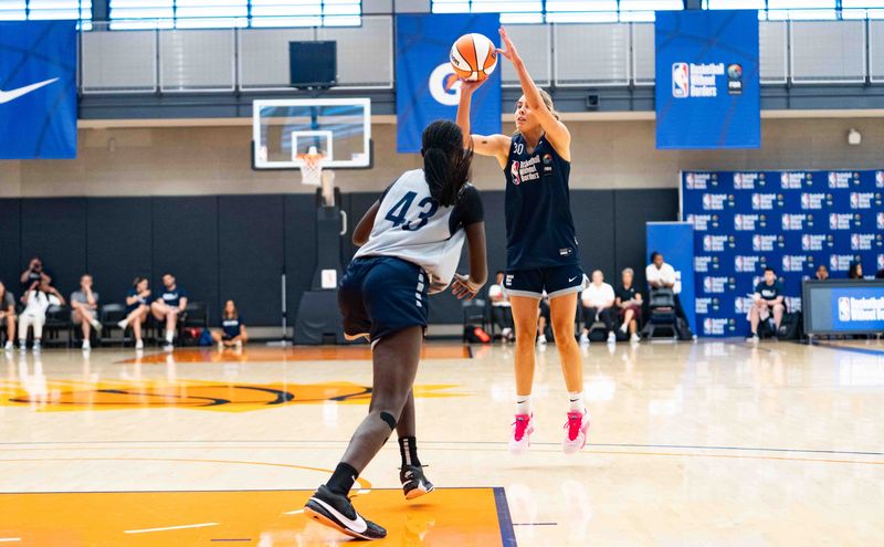 Jul 20, 2024; Phoenix, Ariz., United States; Sienna Harvey (30) shoots the ball during the Basketball Without Borders Global girls camp at Verizon 5G Performance Center in Phoenix on July 20, 2024.