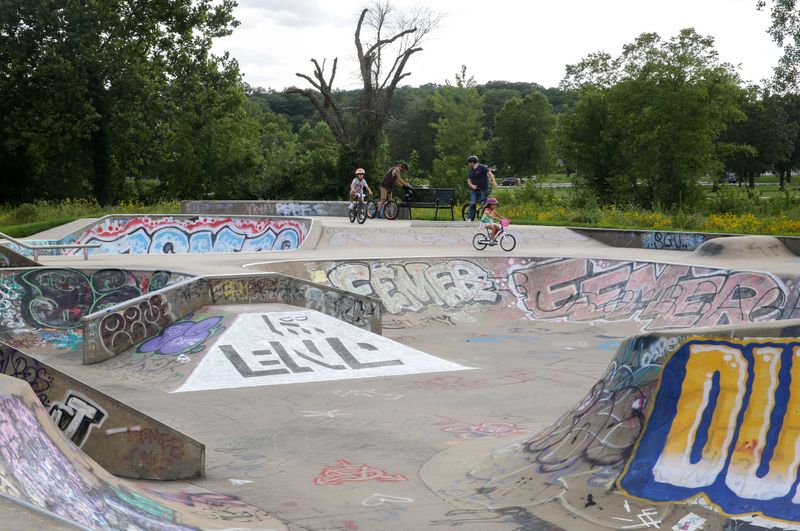 People ride bikes at the Iowa City Skatepark Friday, July 19, 2024 in Iowa City, Iowa.