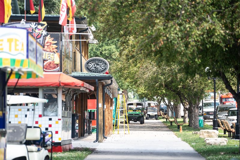 Tools and vehicles are seen near food vendor booths in preparation for the 2024 Iowa State Fair at the Iowa State Fairgrounds on Thursday, Aug. 1, 2024 in Des Moines.